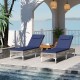 Two navy patio chaise lounge chairs with adjustable backrests, perfect for poolside relaxation and sunbathing.