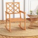 Teak wood rocking chair with slatted seat and backrest, perfect for outdoor relaxation on the porch or patio.