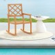 Teak wood oversized rocking chair with slatted seat and backrest, perfect for relaxing by the poolside or patio.