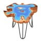 Irregular 21-inch teak wood end table with blue epoxy resin top and sturdy metal legs, perfect for outdoor use.