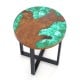 Round teak wood outdoor end table with epoxy resin top, featuring natural grain and X-shaped mahogany support legs.