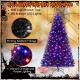 7 ft artificial Christmas tree with black foliage, vibrant orange and purple lights, perfect for Halloween and.