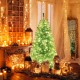 6 FT blue artificial Christmas tree with warm white LED lights, set in a cozy decorated room for festive ambiance.