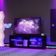 Modern TV stand with LED light, adjustable shelves, and a wide tabletop for TVs up to 65 inches, enhancing your living.