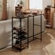Rustic brown bar height dining table with storage shelves, wine racks, and stemware holders for versatile home use.