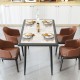 Rectangular sintered stone dining table with golden metal frame, stylish design for indoor dining, seats 4 comfortably.