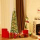 Pencil Christmas tree with warm LED lights and memory wire branch tips, surrounded by festive gifts in a cozy living.