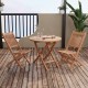 Outdoor bistro set featuring a slatted teak wood tabletop and folding chairs, perfect for backyard dining.
