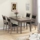 Elegant dining table set with gray upholstered chairs, featuring a hollowed backrest design for enhanced comfort and.