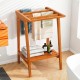 Freestanding towel rack made of premium Indonesian teak with storage shelf, ideal for bathroom or pool use.