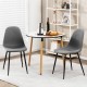 Gray dining chairs with black metal legs, featuring foam upholstery and ergonomic backrest, ideal for dining rooms.