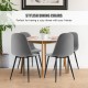 Set of 4 gray dining chairs with black metal legs, featuring foam upholstery and ergonomic backrest for comfort.
