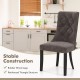 Tufted dining chair with high backrest in gray, featuring rubber wood legs and reinforced triangle structure for.