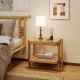 Rattan 2-tier end side table with tempered glass top and acacia wood legs, perfect for bedside or living room storage.