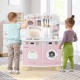 Wooden kids kitchen playset in pink featuring a coffee maker, stove, and realistic knobs for imaginative play.