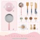 Wooden kids kitchen playset in pink featuring a coffee maker, stove, and utensils for imaginative cooking fun.