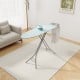 Foldable turquoise ironing board with adjustable height, iron rest, and sturdy metal frame for easy storage and.