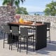 7-piece patio rattan bar set with acacia wood tabletop and soft cushions, perfect for outdoor gatherings in the garden.