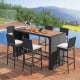 7-piece patio rattan bar set with acacia wood tabletop and soft cushions, ideal for outdoor gatherings by the poolside.