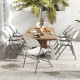 Set of four white folding stackable chairs with metal frame, perfect for outdoor dining and easy storage.