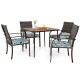 Square table with four cushioned rattan armchairs, perfect for outdoor dining in backyard or poolside settings.