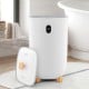 40L white towel warmer with wooden legs, LCD control panel, and dual fragrance disc holders for luxurious warmth.
