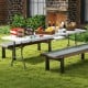8 ft portable folding table with HDPE tabletop, ideal for outdoor use, set up for a picnic with food and drinks.