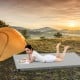 High-density foam sleeping mat in grey, ideal for camping and outdoor use, featuring a waterproof cover and foldable.