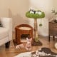 Multifunctional cat tree with a cozy top perch and private condo, featuring scratching posts and plush cushions for.