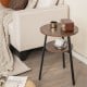Round end table with triangular metal frame and walnut finish, featuring two open shelves for versatile storage.