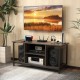 3-tier gray TV stand with adjustable shelf, power outlet, and open storage for media supplies and audio speakers.