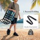 Low folding beach chair with cushion in blue, featuring lightweight aluminum frame and shoulder strap for easy.