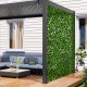Expandable fence privacy screen with sun-protective artificial hedge, ideal for balcony or patio privacy and decoration.