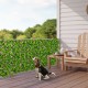 Expandable fence privacy screen with realistic faux eucalyptus leaves, perfect for balcony or patio privacy.