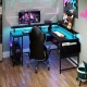 L-shaped gaming desk in black with LED lights, adjustable features, and ample storage for an organized gaming setup.