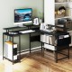 L-shaped black gaming desk with LED lights, power outlets, and ergonomic monitor stand for home office use.