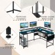 L-shaped gaming desk in black with LED lights, power outlets, and adjustable foot pads for enhanced stability and.