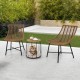 Two ergonomic brown rattan chairs with a pet house side table, perfect for outdoor patio relaxation.