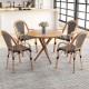 Round dining table with four hand-woven PE wicker French bistro chairs, perfect for outdoor patio or backyard use.