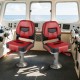 Set of 2 red folding low back fishing boat seats with ergonomic support, ideal for marine environments and easy storage.