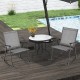 Two gray folding rocking chairs with breathable fabric and a round table, perfect for outdoor relaxation by the pool.