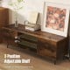 TV stand in rustic brown with adjustable shelf, 2 open shelves, and power outlets for convenient media storage.