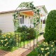 Garden arbor with a decorative arch and double-door gate, perfect for climbing plants and outdoor privacy.