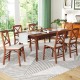 Folding dining chair with padded seat and rubber wood frame, showcasing an ergonomic design for comfort in compact.