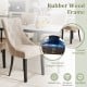 Light brown tufted wingback dining chair with rubber wood frame and nailhead trim, perfect for stylish kitchen seating.