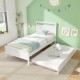 Twin size wooden bed frame with trundle in white, featuring sturdy slats and elegant design for versatile bedroom use.