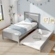 Twin size gray wooden bed frame with trundle, featuring sturdy slats and elegant design for versatile bedroom use.