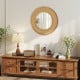 Bohemian round wall-mounted mirror with a natural wooden frame, ideal for living room or entryway decor.