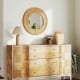 Bohemian round wall mirror with wooden frame, showcasing rustic elegance, ideal for entryway or living room decor.
