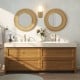 Bohemian round wall-mounted mirror with a natural wooden frame, perfect for adding rustic elegance to any space.